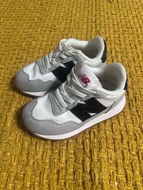 New Balance Kids White, Gray & Black Sneakers with Pink Logo